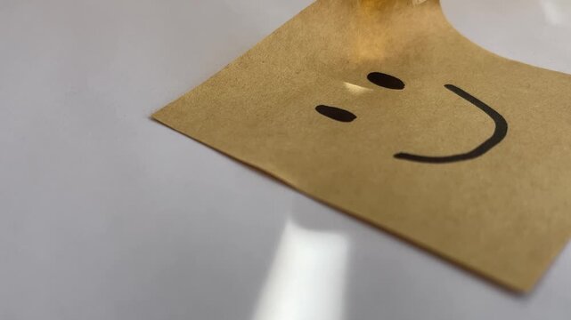 Smiley face sticky note with sunlight mental health concept