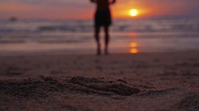 Close Up of a Snorkeling Mask on Sand With a Male Hand Reaching Down at Sunset, Beach Recreation and Summer Vacation by the Sea