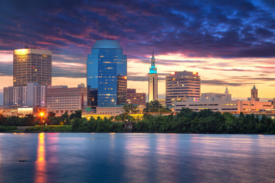 Springfield, Massachusetts, USA. Cityscape image of Springfield, Massachusetts with reflection of the city skyline in the water at beautiful sunrise.
