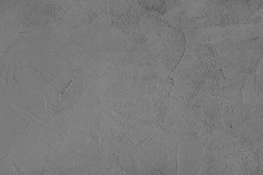 Gray stucco wall, uneven plaster surface, painted distressed concrete texture background. Abstract grunge backdrop, wallpaper for design, construction design element