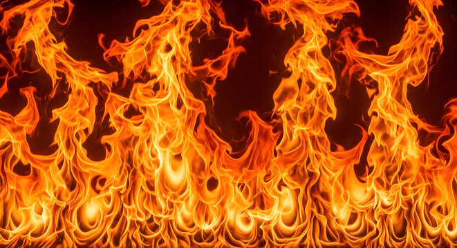 Real fiery wall of blazing fire flames background texture, vibrant orange warm bonfire blaze inferno abstract pattern