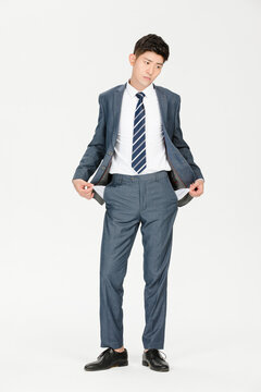 Worried businessman showing empty pockets in financial trouble