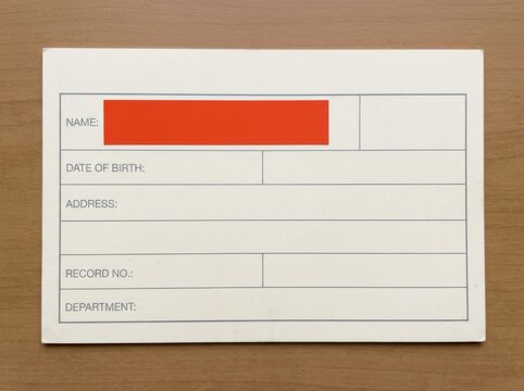 Patient intake form with redacted name and record fields