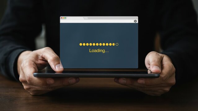 Person holding tablet with loading screen