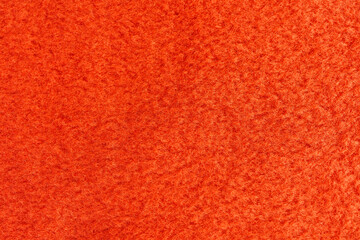 Orange fleece fabric texture background with soft textile surface © Iryna Miadzvedzeva