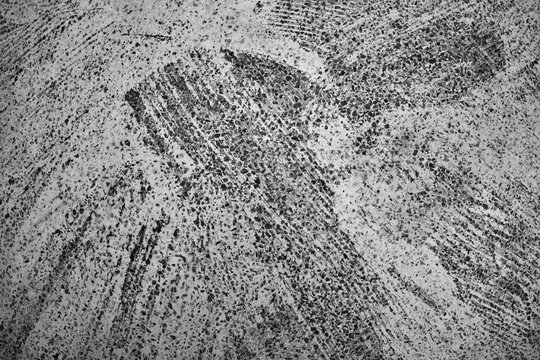 Monochrome Rough Concrete Texture Background
Detailed monochrome rough concrete surface with distressed scratched texture, offering an abstract background for industrial graphic design projects.
