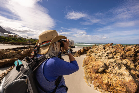 photographer on Kammabaai Beach, Hermanus, South Africa