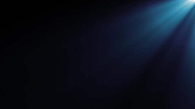 Cyan blue corner spotlight rays on dark background. Glowing volumetric light beam animation, sunrays light effect, atmospheric haze footage for video editing.