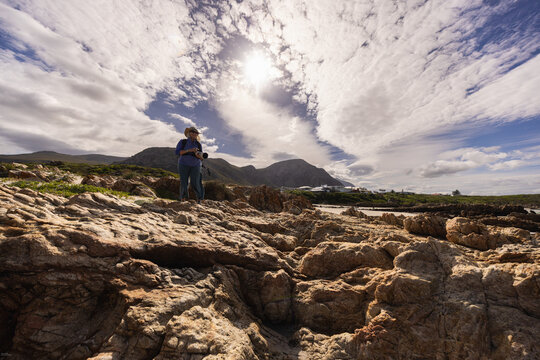 photographer on Kammabaai Beach, Hermanus, South Africa