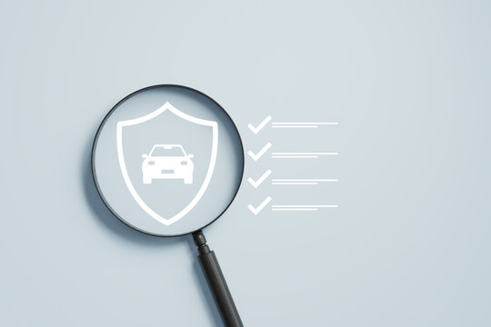 magnifying glass focusing on a car shield icon with a checklist on a light blue background, representing the process of reviewing vehicle protection