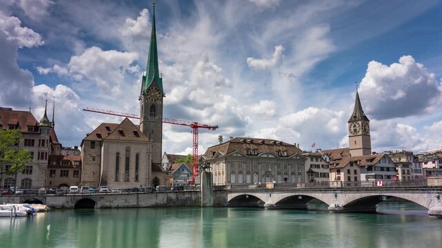 Zurich Cityscape Timelapse of Fraumunster Church and Limmat River with Rushing Clouds over Historic Old Town Bridge