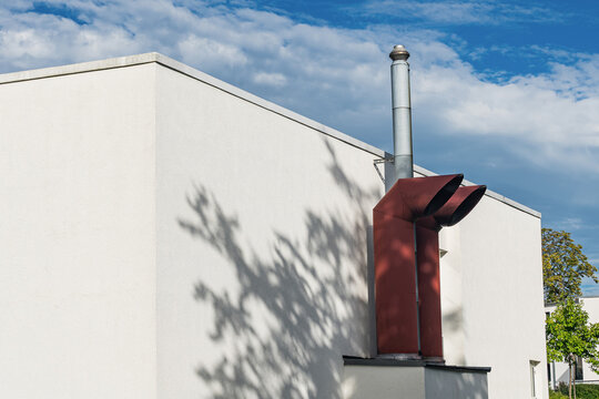 Chimney structure with shadows under a blue sky in the afternoon