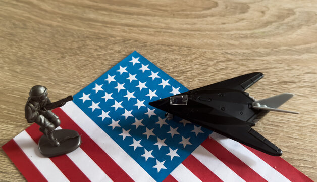 Toy plane with USA flag background 