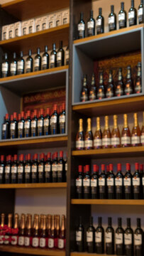 Retail shelves displaying diverse wine and sparkling beverage bottles, representing a broad selection for consumers, hospitality, and the vibrant alcohol industry