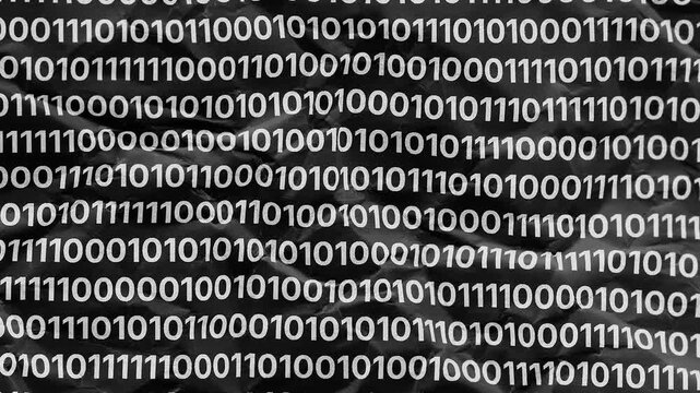 A textured background of crumpled black paper covered with rows of repeating white binary code.