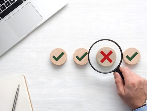 Data Analyst Inspecting Transaction Discrepancy and Fraudulent Activity with Magnifying Glass on Modern Laptop Desk