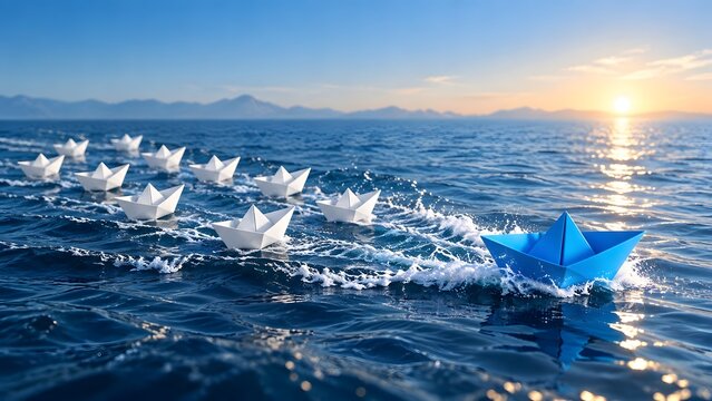 Blue paper boat leading a fleet of white boats on ocean waves at sunset symbolizing leadership and business strategy