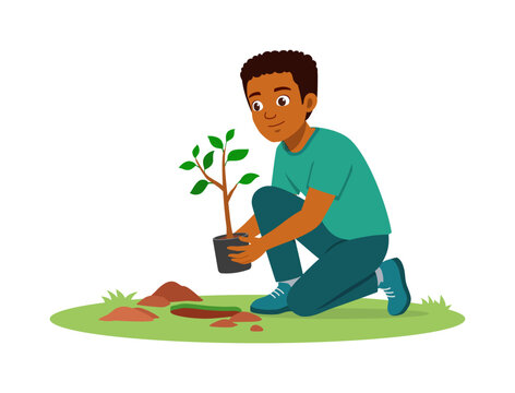 Happy African American young man kneeling planting a small tree sapling in the garden