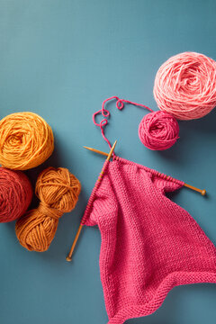 Knitting sweater in pink color, work in progress