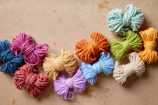 Fluffy colorful yarn in a variety of colors and textures for knitting, crochet and handmade crafts.