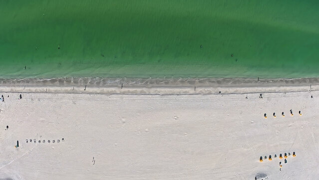 Travel and Tourism: Directly Above Aerial View of White Sand Beach Meeting Emerald Water in St. Pete Beach, Florida