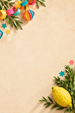 Sukkot background with etrog, myrtle branches and colorful paper sukkah decorations