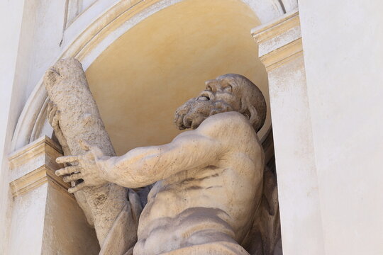 Statue of Saint Andrew Detail on the Facade of the Santi Andrea e Claudio dei Borgognoni Church in Rome, Italy