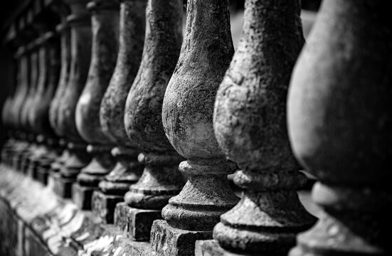 Close-up of a historic stone balustrade at Castle Howard in North Yorkshire, England, photographed in high-contrast black and white with selective focus and strong perspective.