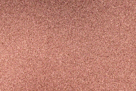 Abstract cocoa and blush gradient backdrop with soft muted colors and coarse granular grain texture creating a subtle blurred noise effect