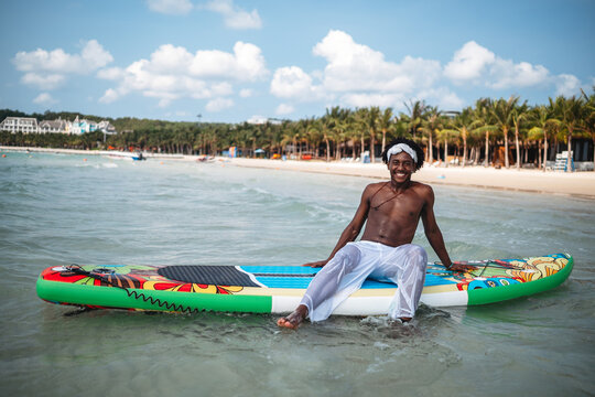 Luxury beach resort vacation with young man, tourist enjoying water activities on summer vacation