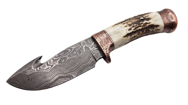 Custom damascus steel hunting knife with textured stag antler handle and decorated brass bolster.