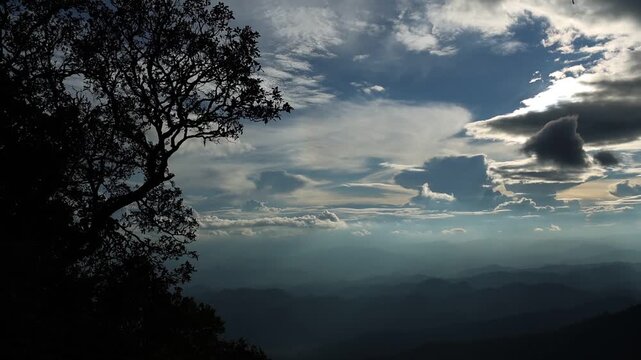 Panoramic Mountain Landscape Under Dramatic Blue Sky and Clouds
