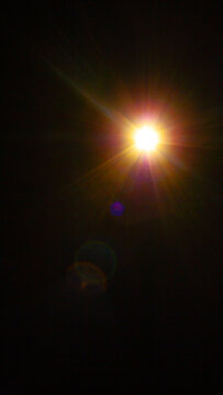 Sun flare on the black background