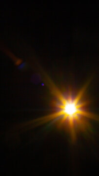 Sun flare on the black background