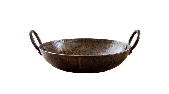 Vintage iron kadai with side handles, rustic hammered metal wok for traditional cooking, antique cast iron frying pan for ethnic cuisine isolated PNG with Transparent Background