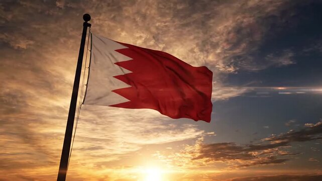 Bahrain flag waving on a flagpole at sunset