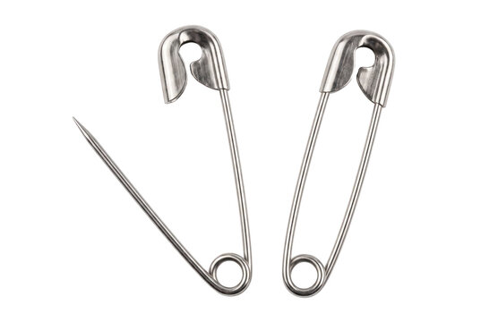 Pair of metallic silver safety pins with one open and one closed