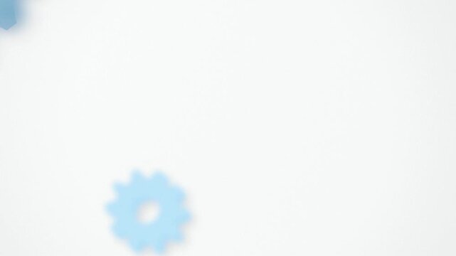 Light blue gear turning endlessly seamless loop background