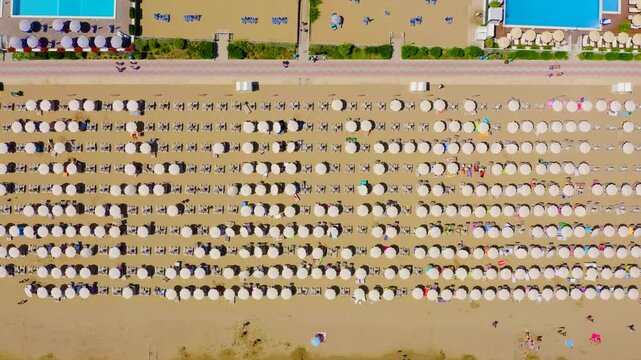 Italy, Jesolo. Lido di Jesolo, or Jesolo Lido, is the beach area of the city of Jesolo in the province of Venice. Drone footage, HEAD OVER SHOT