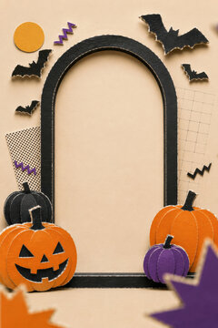 Paper jack o lanterns and bats around a black arch frame. Halloween invitation backdrop with blank centre