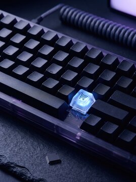 Glowing glass keycap with shopping cart icon on mechanical keyboard