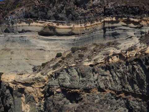 Detailed texture of geological rock layers in volcanic cliff at Balata dei Turchi Pantelleria
