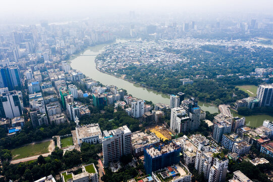 Aerial view of the Gulshan 2 area featuring dense high-rise residential and commercial buildings alongside a winding lake and lush greenery in Dhaka, Dhaka Division, Bangladesh.