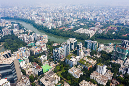 Aerial view of Gulshan 2 in Dhaka, showing dense urban development, modern high-rise buildings, lush green trees, and the winding Gulshan Lake. Dhaka, Dhaka Division, Bangladesh.