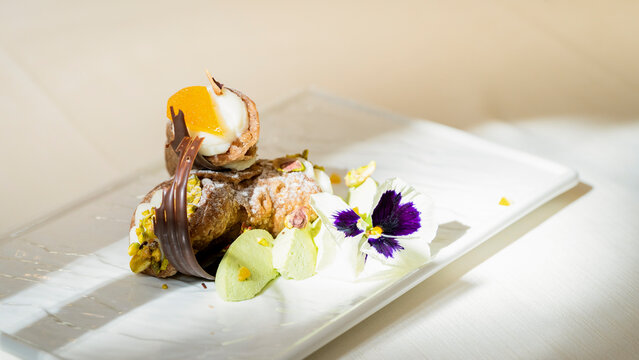 Sicilian cannoli with ricotta, pistachio and candied orange
