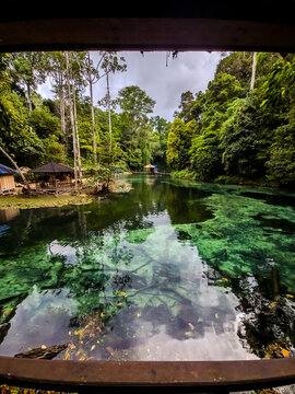 Clear blue-green waters of Tulung Ni Lenggo Lake in Berau, Indonesia