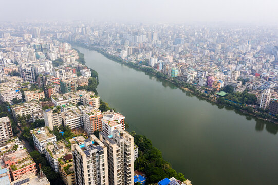 Aerial view of Gulshan 2 area featuring dense urban residential buildings and high-rise apartments along the Gulshan Lake under a hazy sky Dhaka, Dhaka Division, Bangladesh.