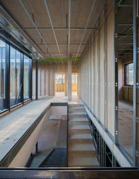 Interior construction of modern house with stairwell framework