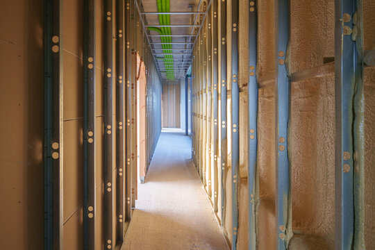 Interior house construction corridor with exposed wall framing