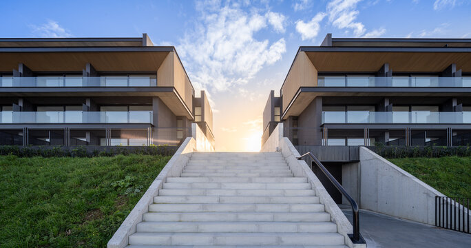 Modern hillside residential architecture with symmetrical stairway